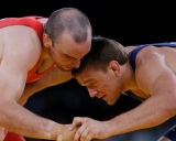 bronze medal match during the 74-kg Greco-Roman wrestling competition at the 2012 Summer Olympics, Sunday, Aug. 5, 2012, in London. (AP Photo/Paul Sancya)