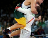 Denmark\'s Mark Overgaard Madsen, red, competes against Lithuania\'s Aleksandr Kazakevic during a 74-kg Greco-Roman wrestling bronze medal match at the 2012 Summer Olympics, Sunday, Aug. 5, 2012, in London. (AP Photo/Paul Sancya)
